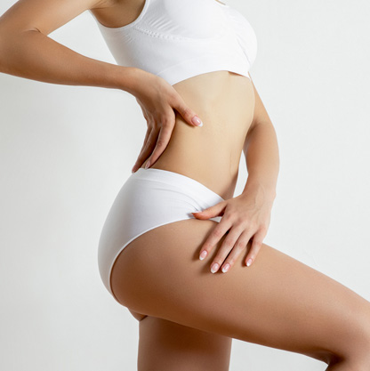 woman-admiring-shape-after-liposuction