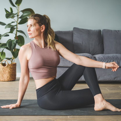 woman-doing-yoga-stretches-at-home