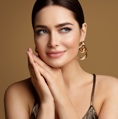 woman-with-smooth-skin-and-gold-jewelry