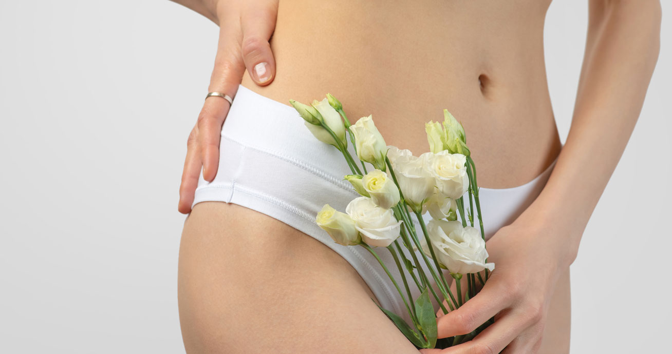 Woman-holding-white-flowers-in-white-underwear
