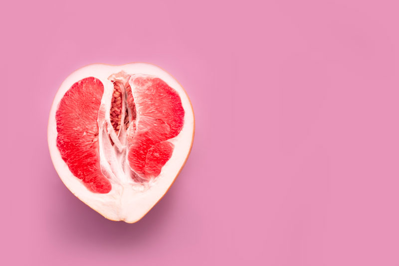 halved-grapefruit-on-a-pink-background